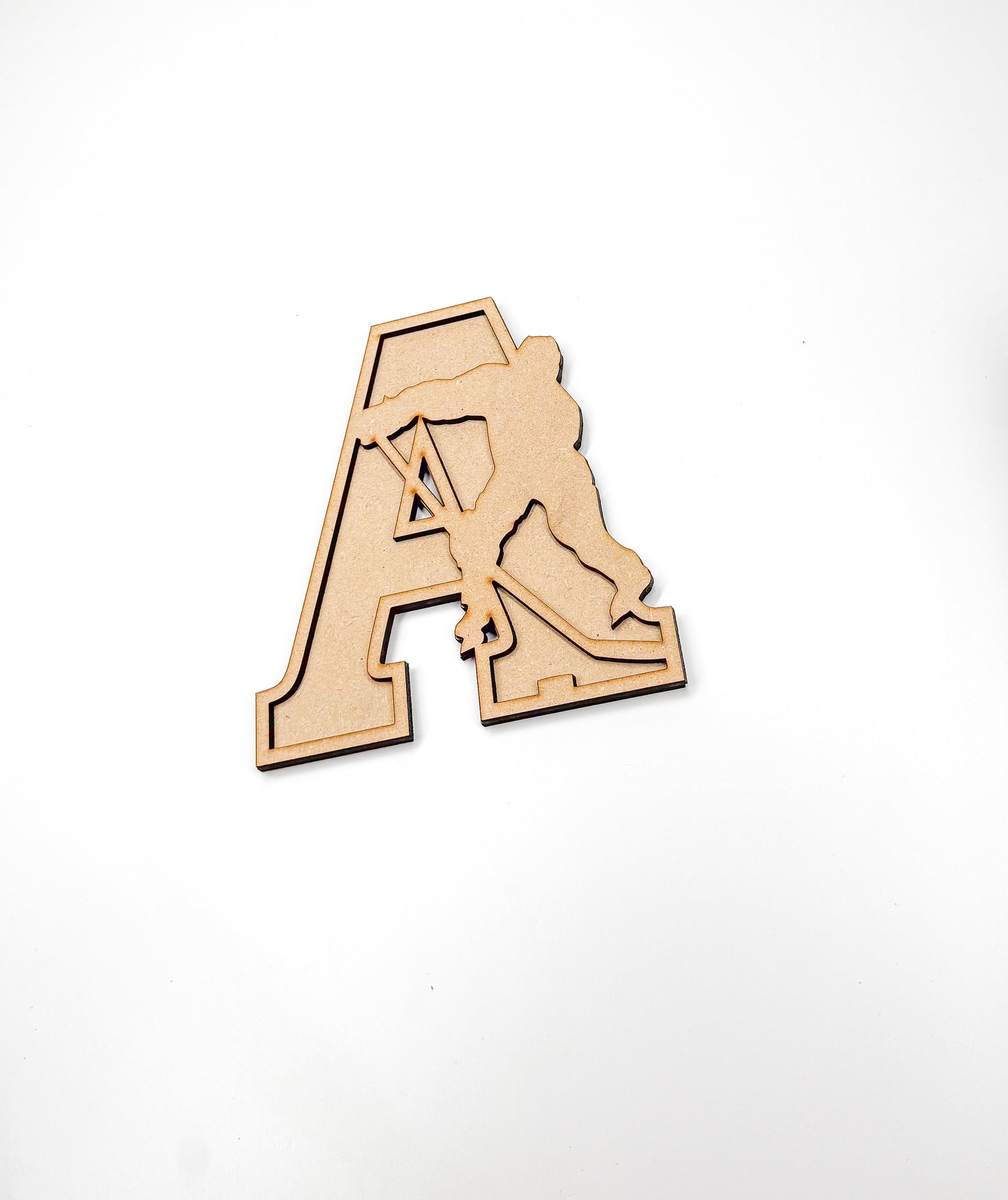 a wooden cut out of the letter a