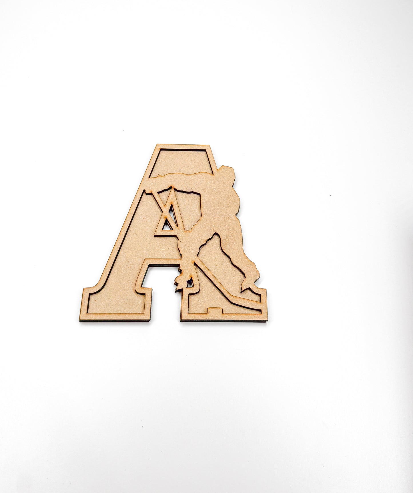 a wooden cutout of a baseball player hitting a ball