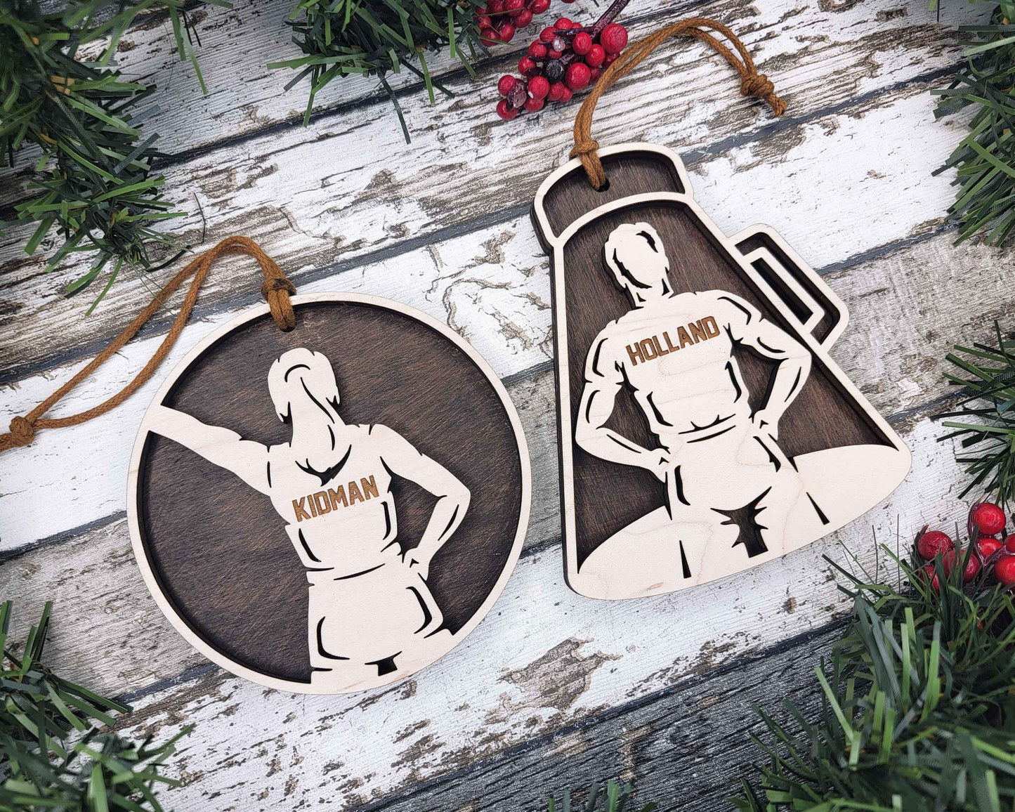 two wooden tags with a picture of a woman holding a knife
