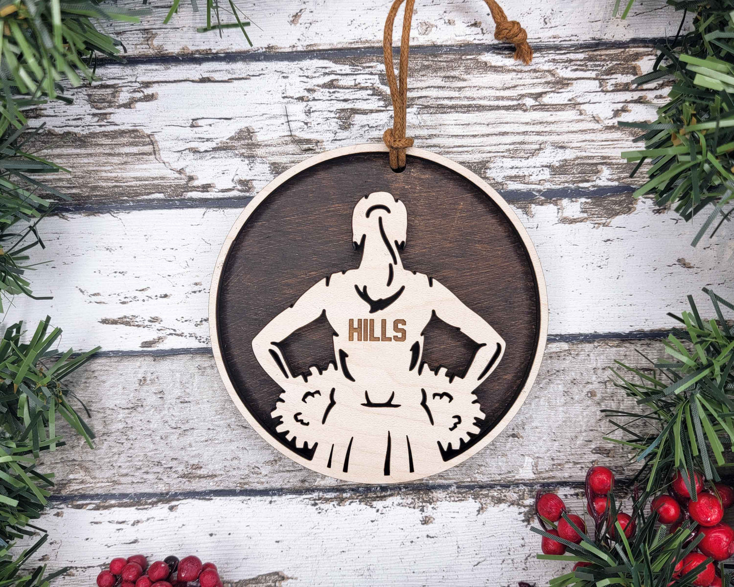 a wooden ornament with a picture of a woman on it