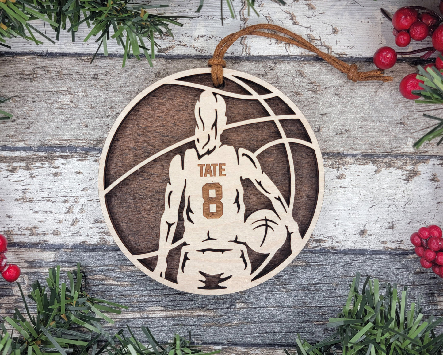 a basketball ornament hanging on a wooden wall