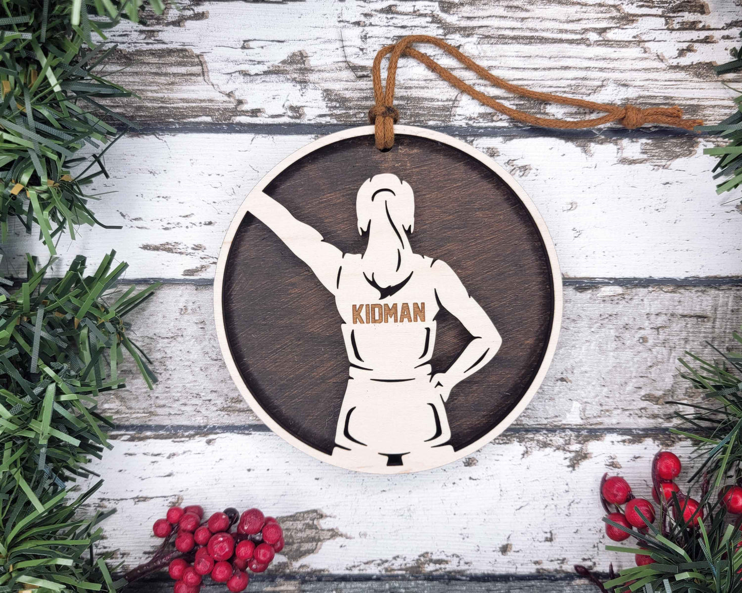 a wooden ornament with a woman's image on it