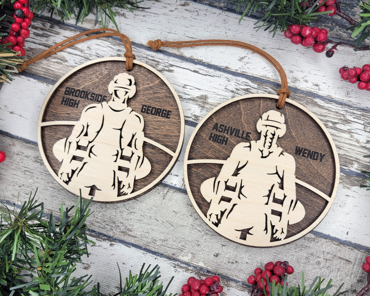 two wooden ornament depicting a skier and a snowboarder