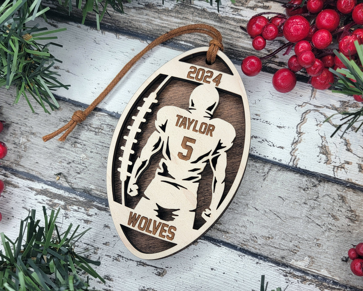 a wooden ornament with a football player on it