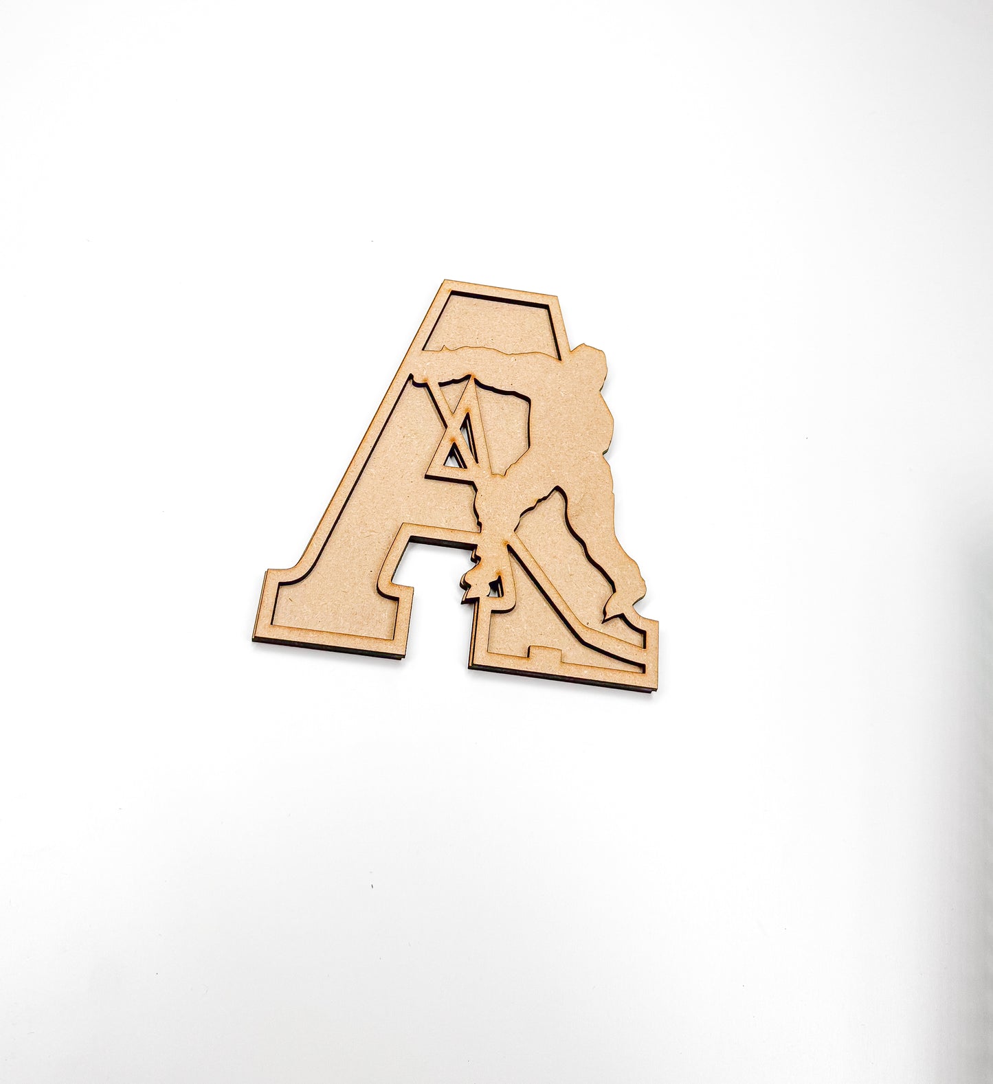 a wooden magnet with the letter a on it