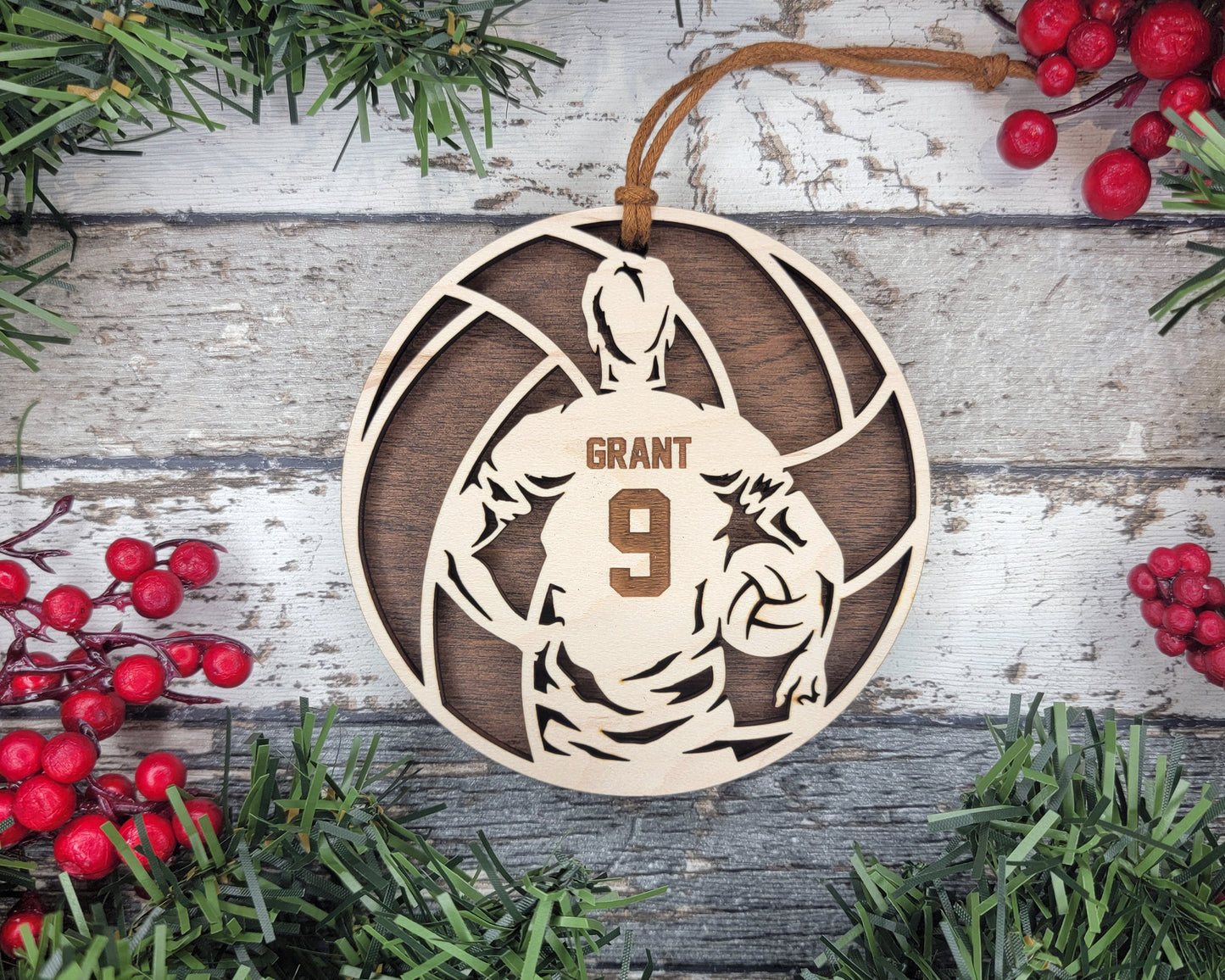 a wooden ornament with a basketball player on it
