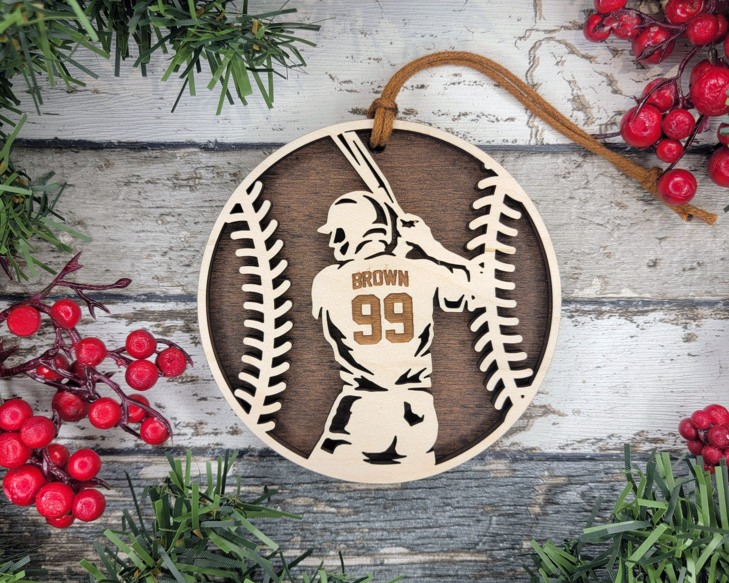 a wooden ornament with a baseball player holding a bat