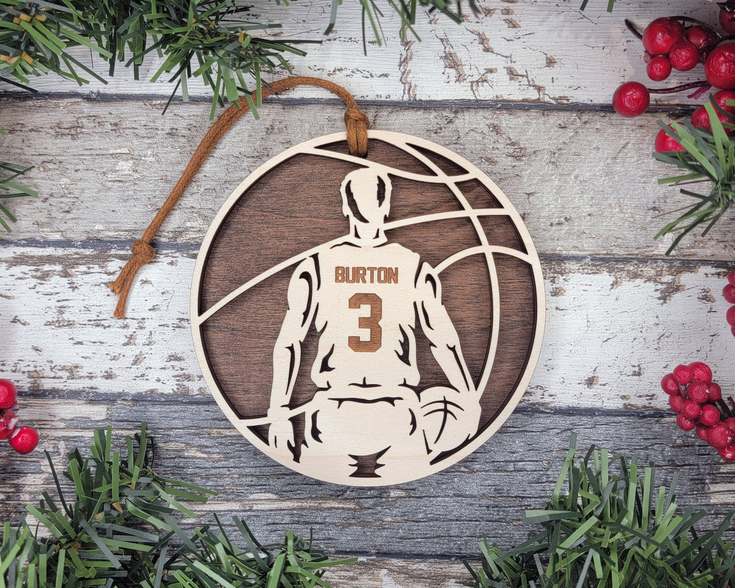 a wooden ornament with a basketball player on it