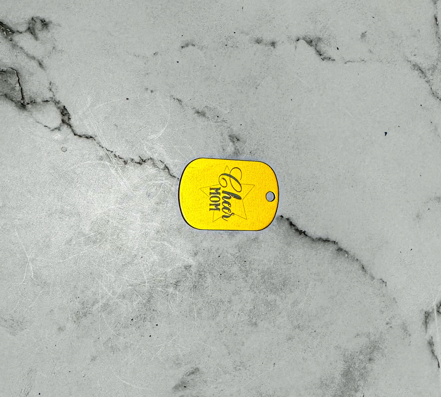 a yellow tag on a white marble surface