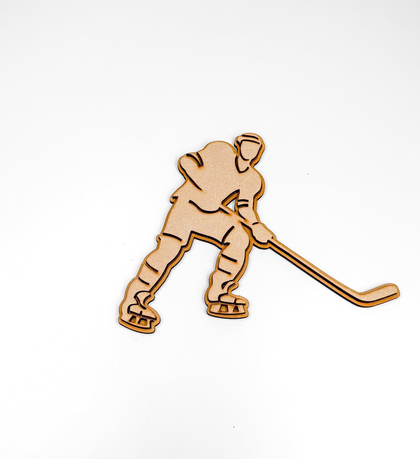 a wooden cutout of a hockey player