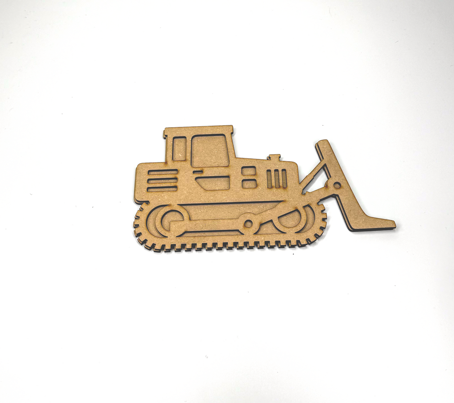 a wooden cutout of a construction vehicle