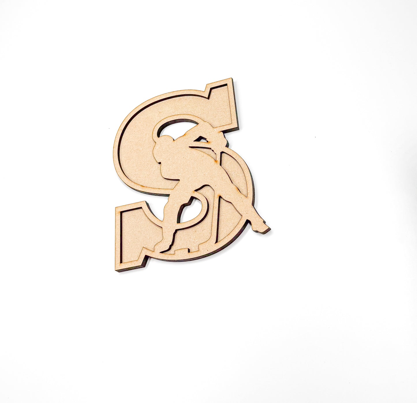 a wooden cut out of the letter g