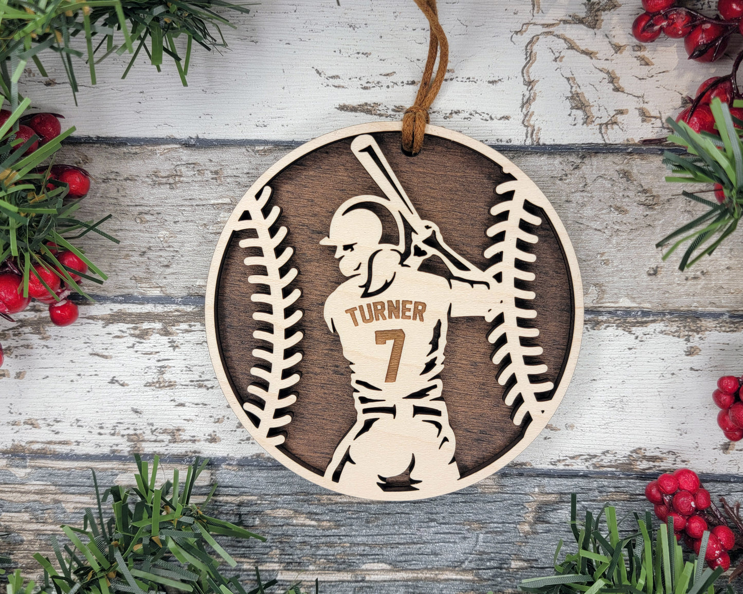 a wooden ornament with a baseball player holding a bat