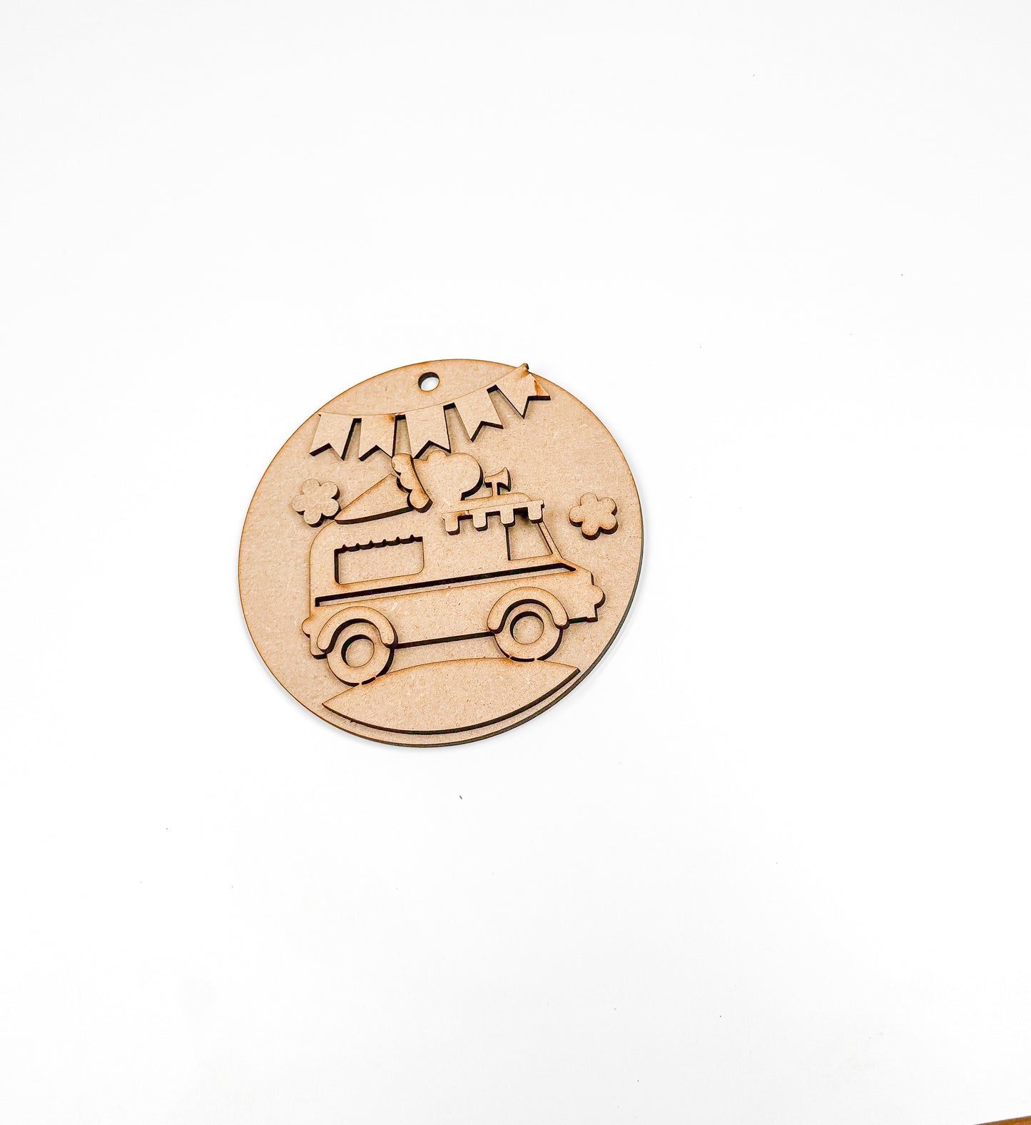 a wooden stamp with a bus and stars on it