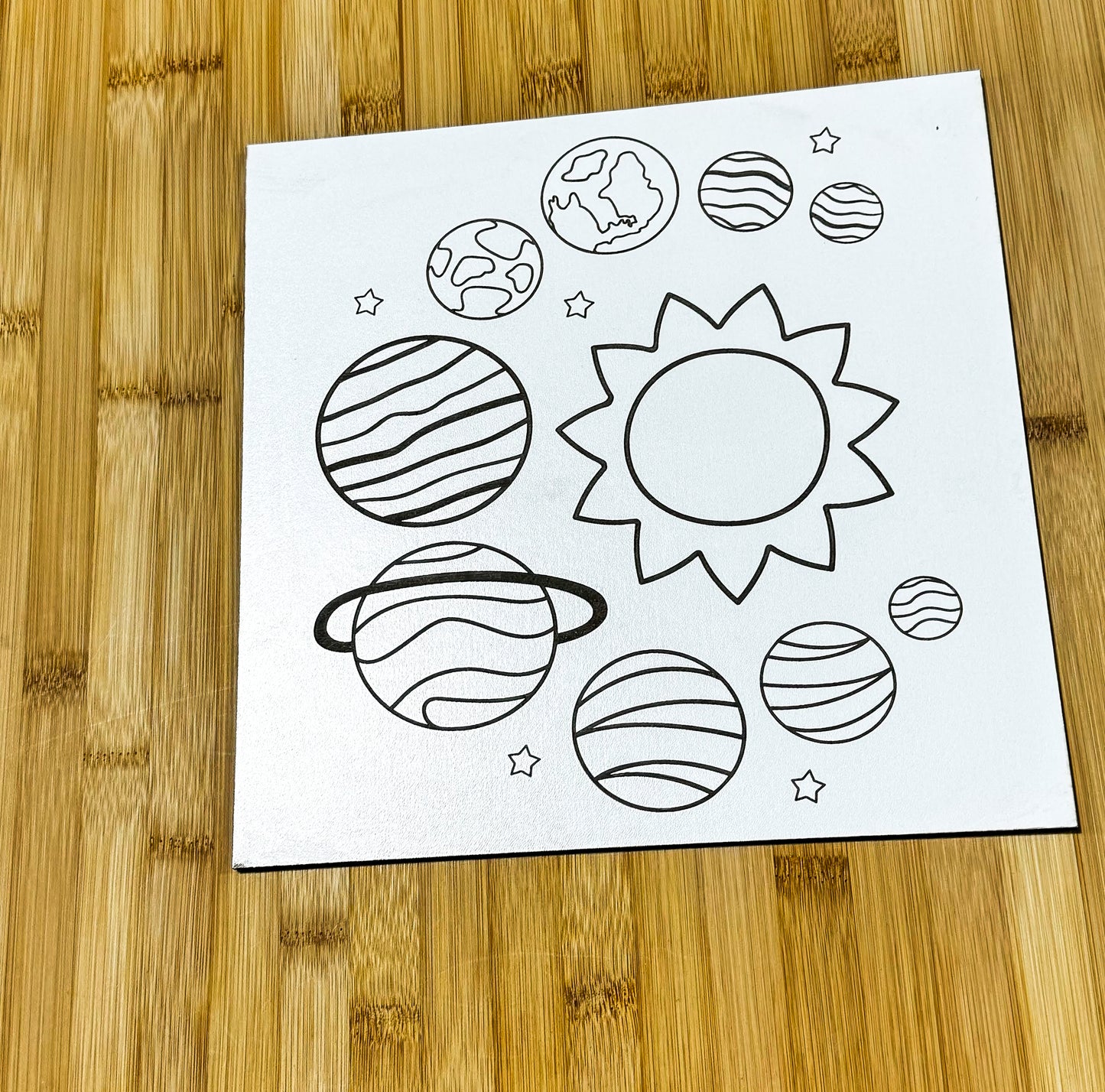 a paper with a picture of planets on it