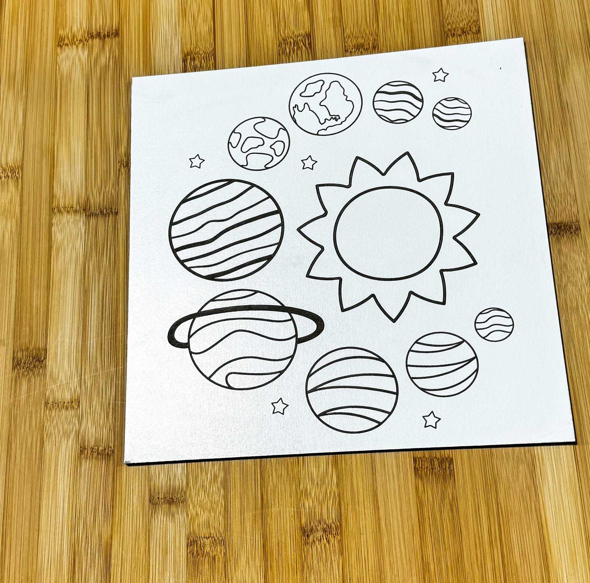 a paper with a picture of planets on it