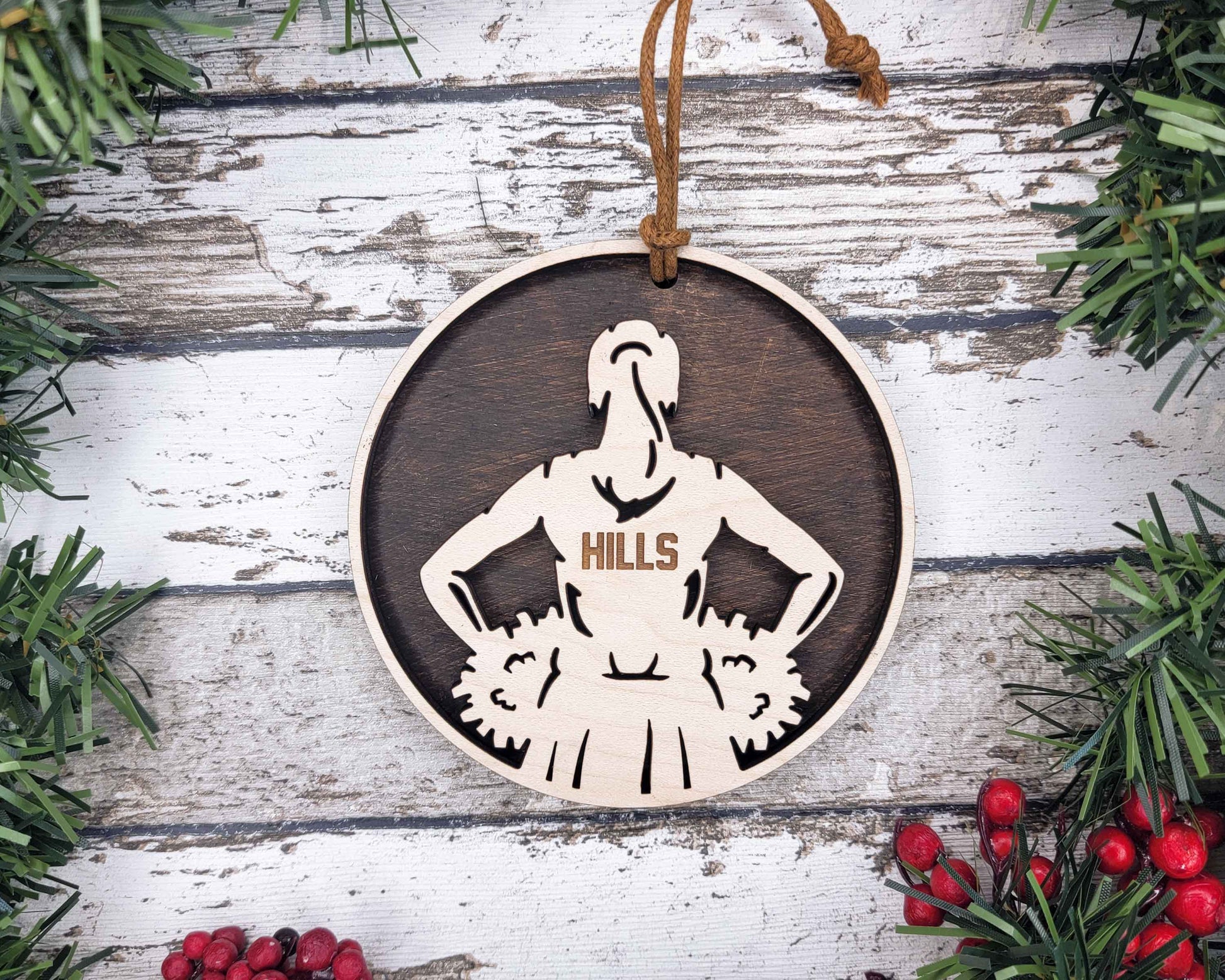 a wooden ornament with a picture of a woman on it