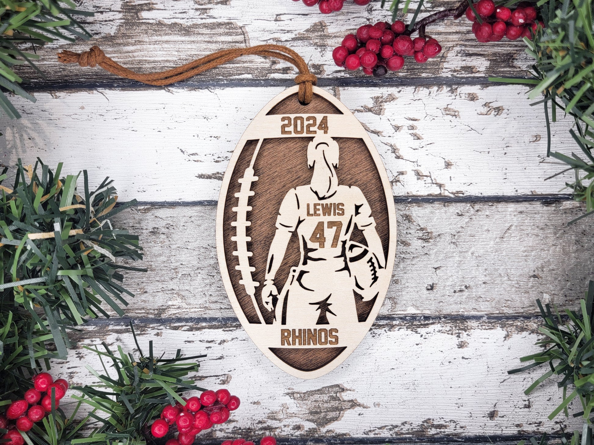 a wooden ornament with a football player on it