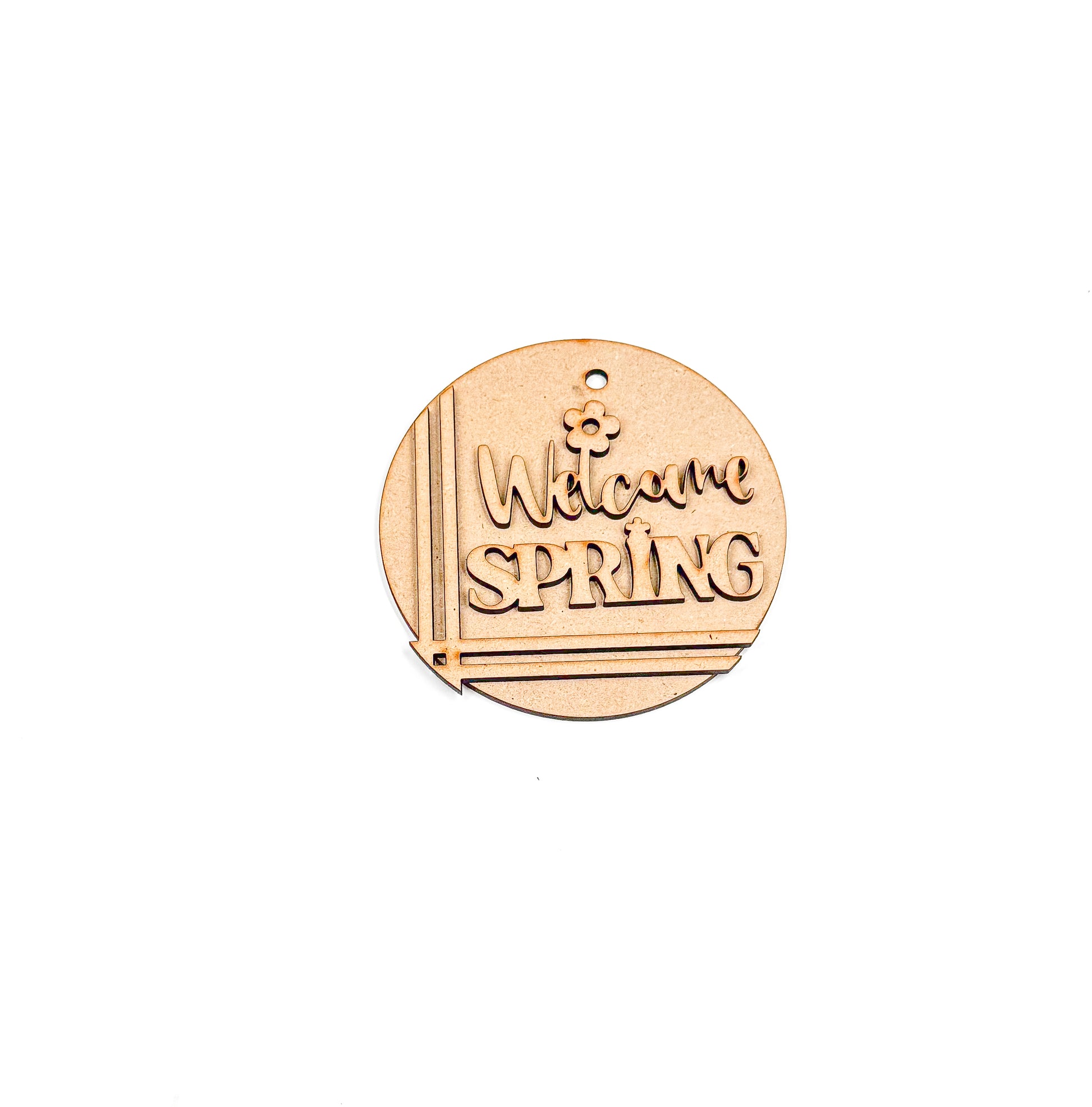 a wooden badge that says welcome spring