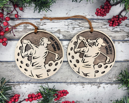 a pair of christmas ornaments with a picture of a baseball player
