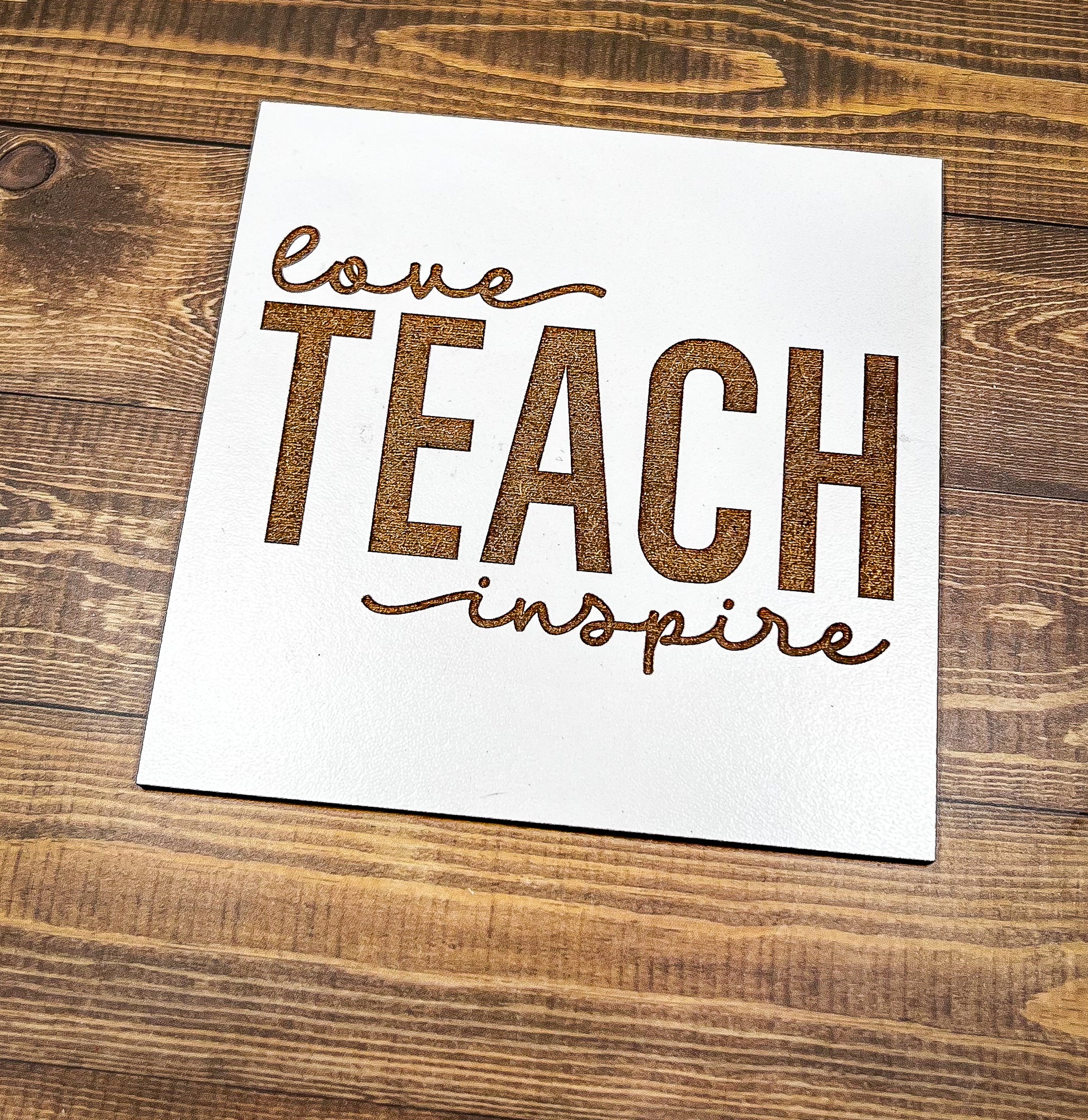 a piece of paper that says love teach inspire