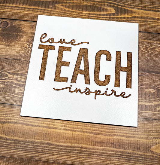 a piece of paper that says love teach inspire