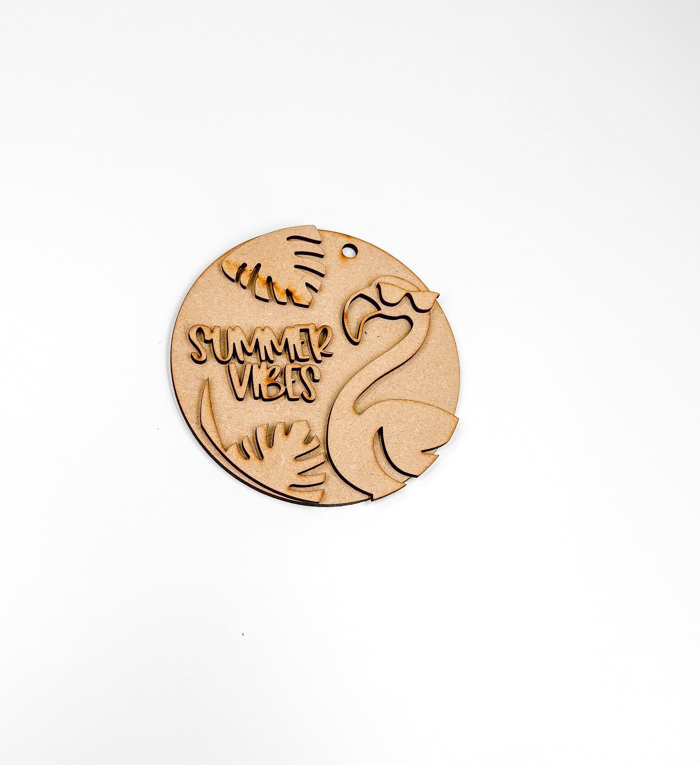 a picture of a wooden brooch with the words summer seven on it