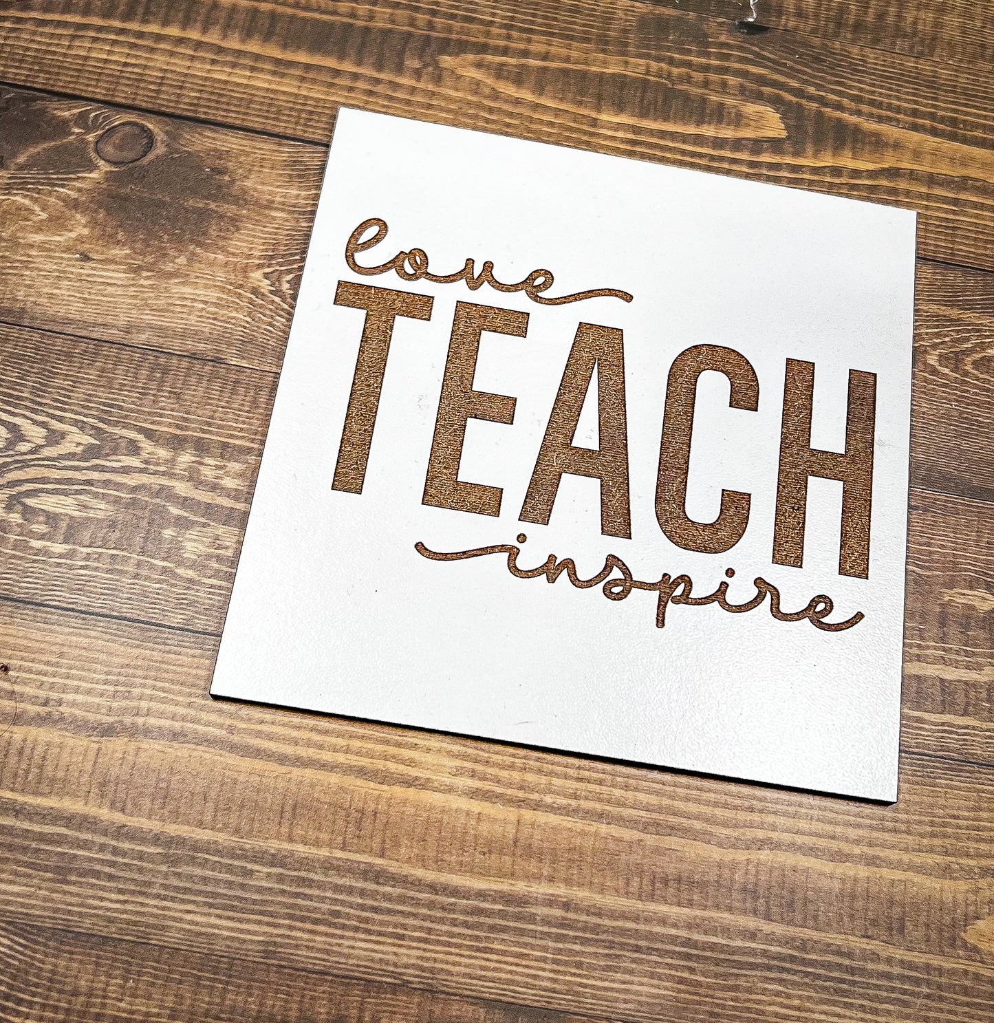 a piece of paper that says love teach inspire