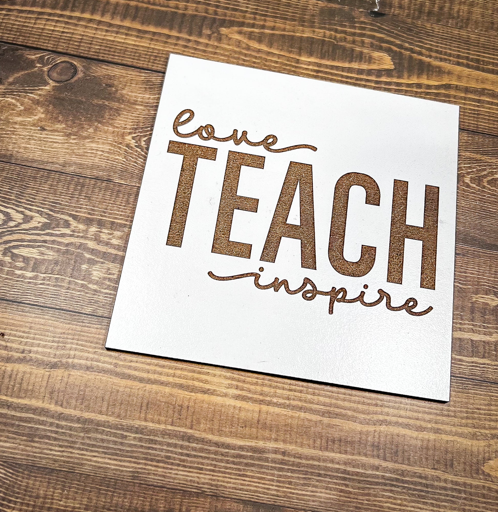 a piece of paper that says love teach inspire