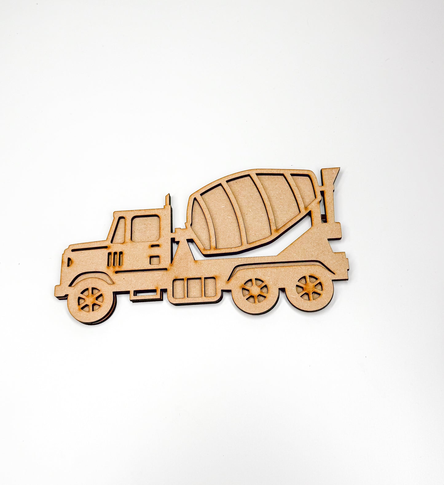 a wooden cutout of a cement truck