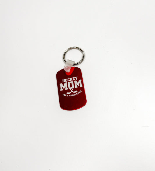 a red keychain with a red tag on it