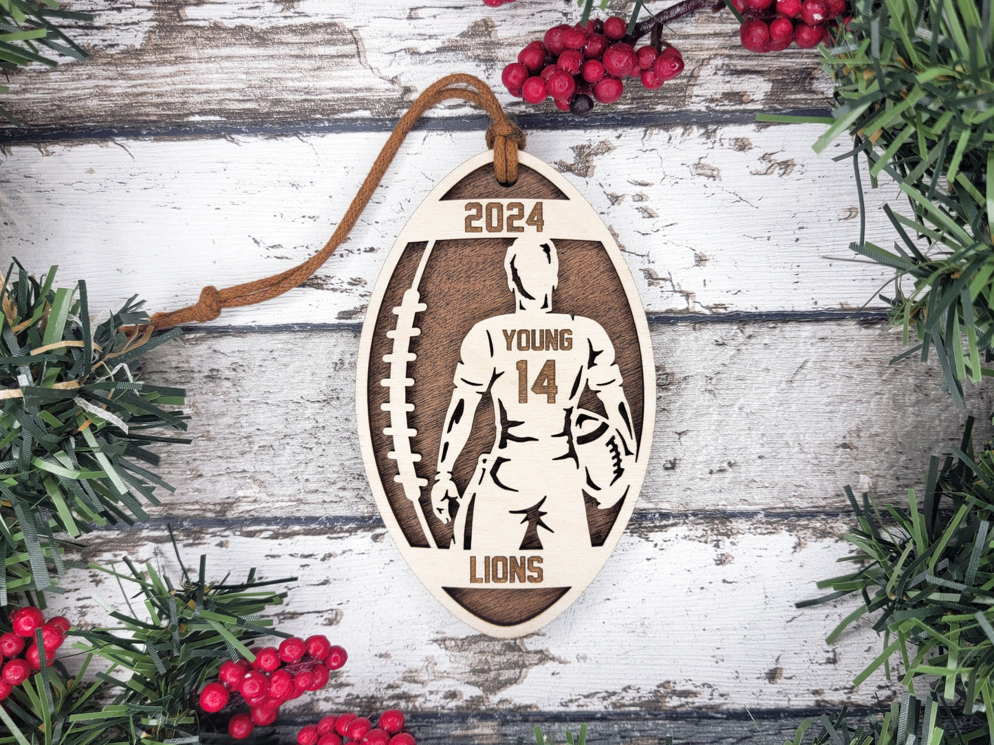 a christmas ornament hanging on a wooden wall