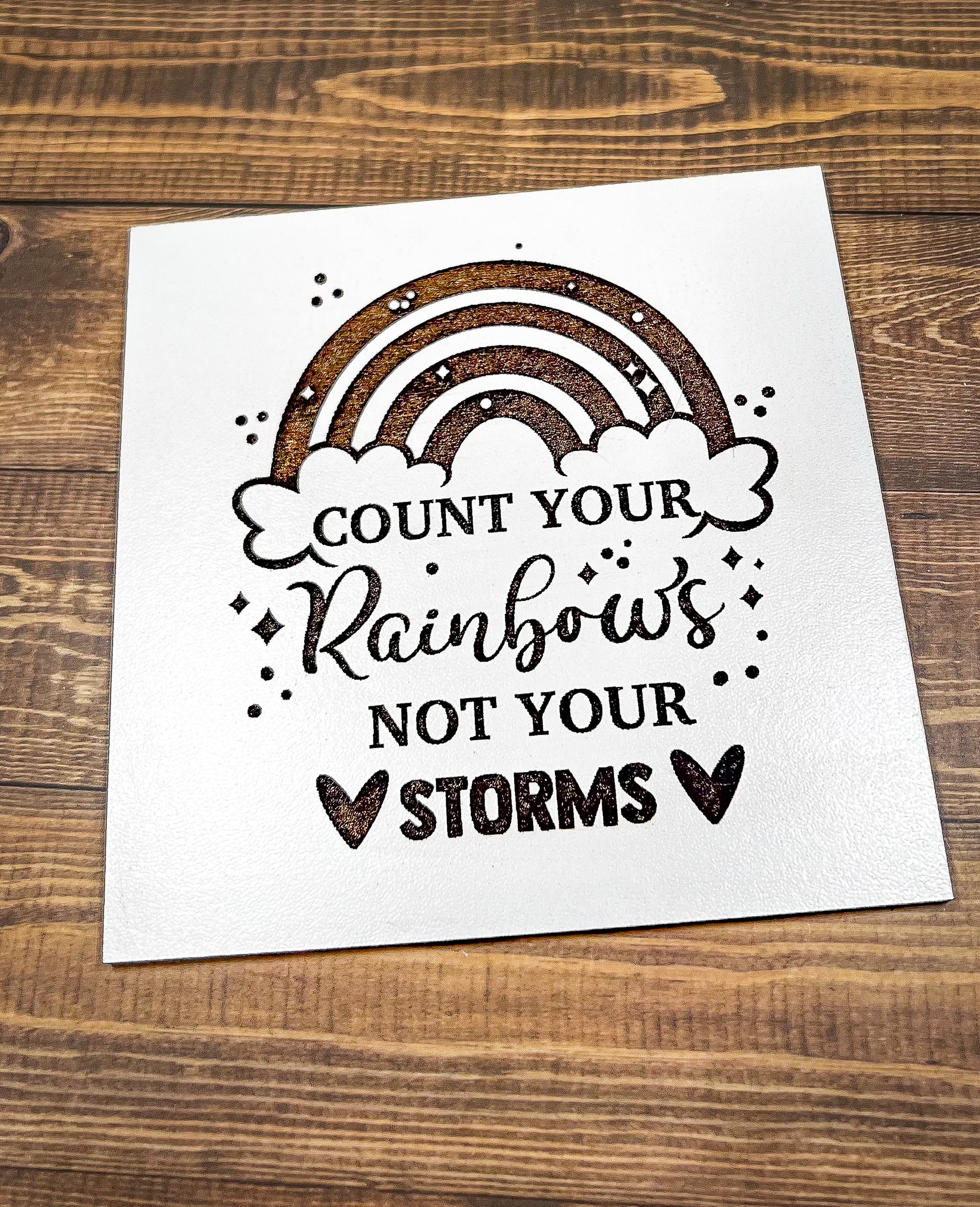 a card that says count your rainbows not your storm