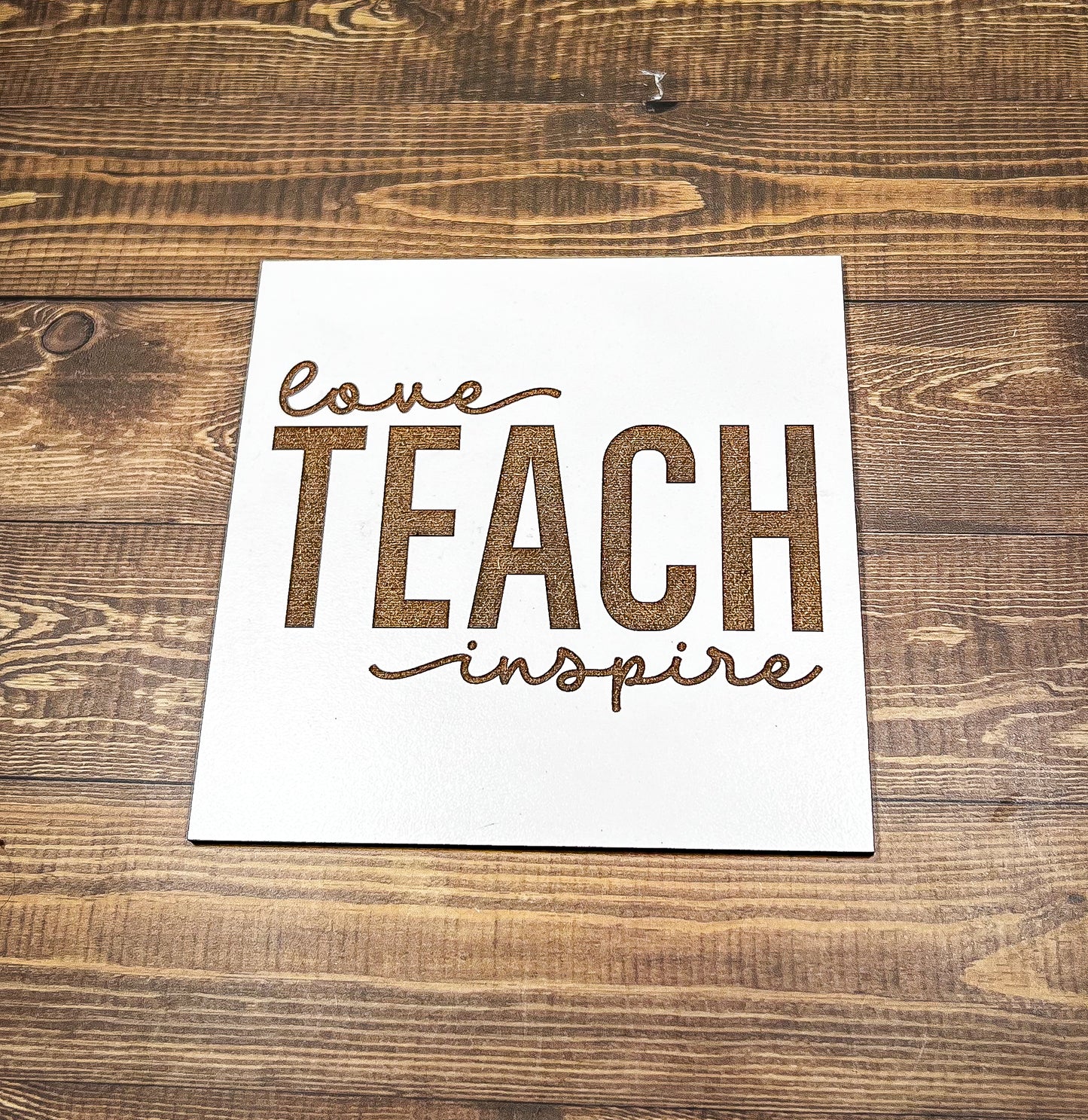 a piece of paper that says love teach inspire