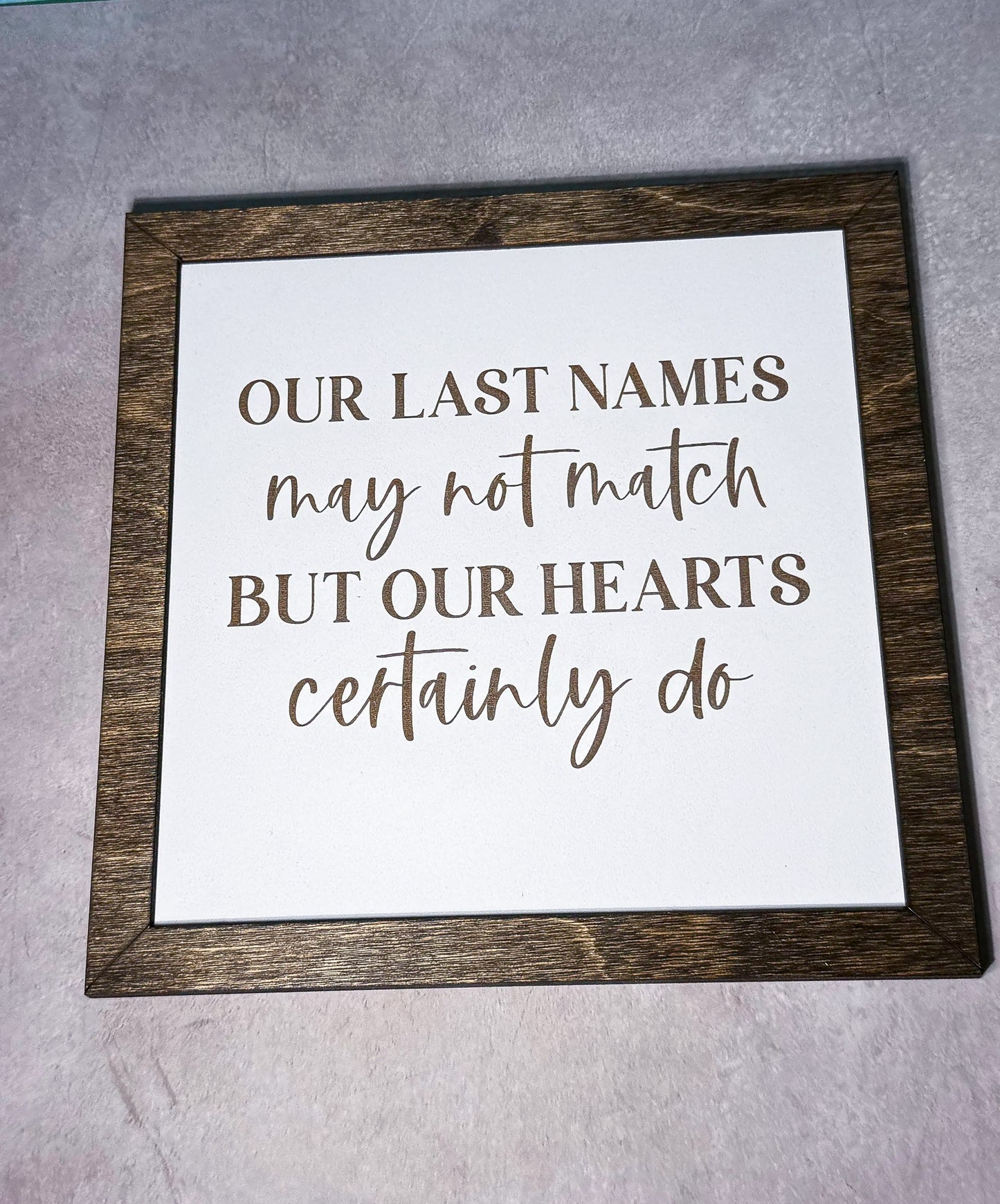 Our Last Names may not match Sign