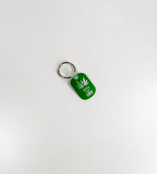 a keychain with a marijuana leaf on it