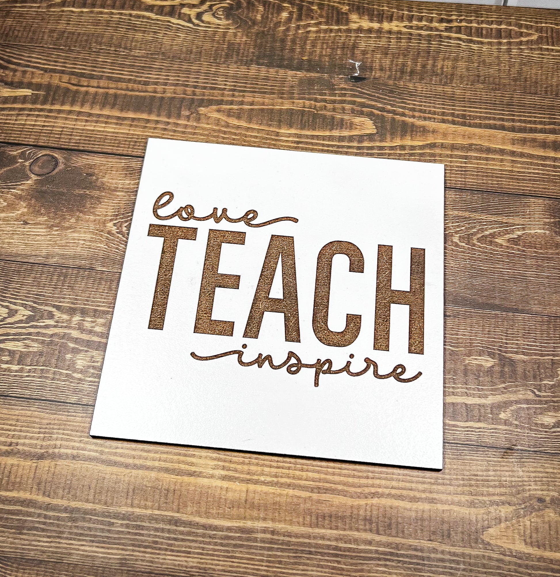a piece of paper with the words love teach inspire on it