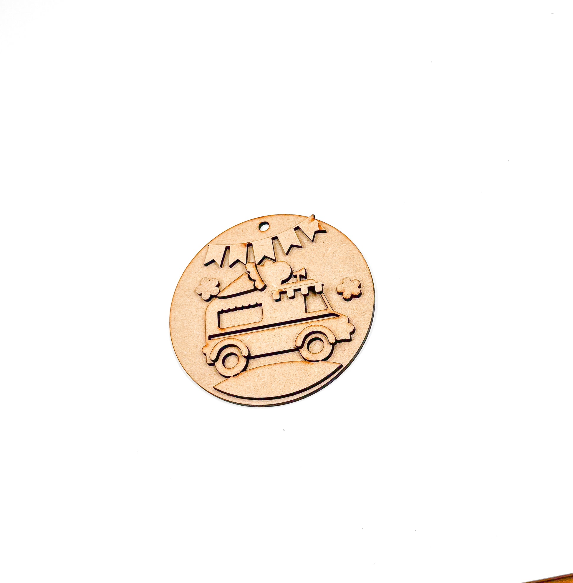 a wooden stamp with a car and stars on it