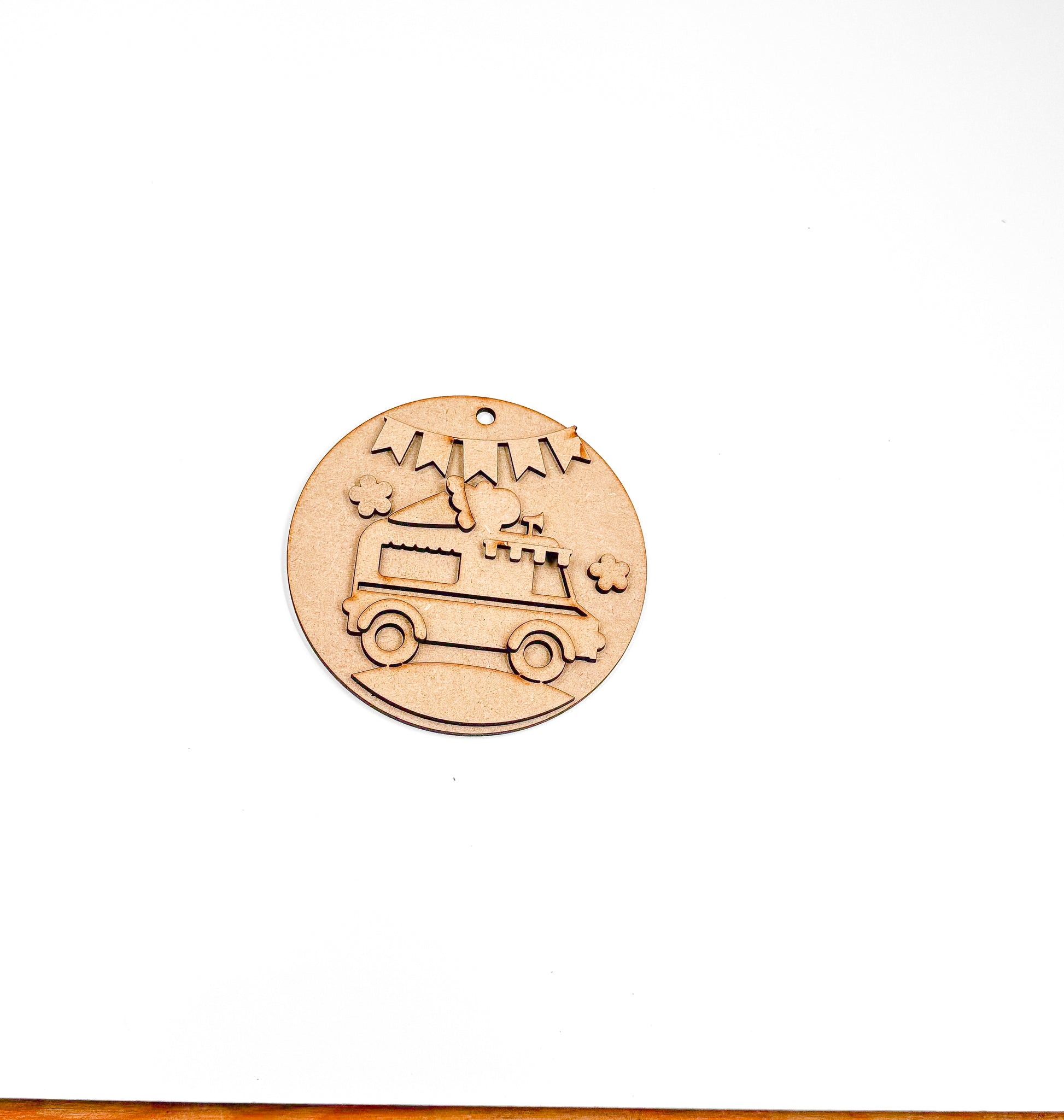 a wooden stamp with a camper on it