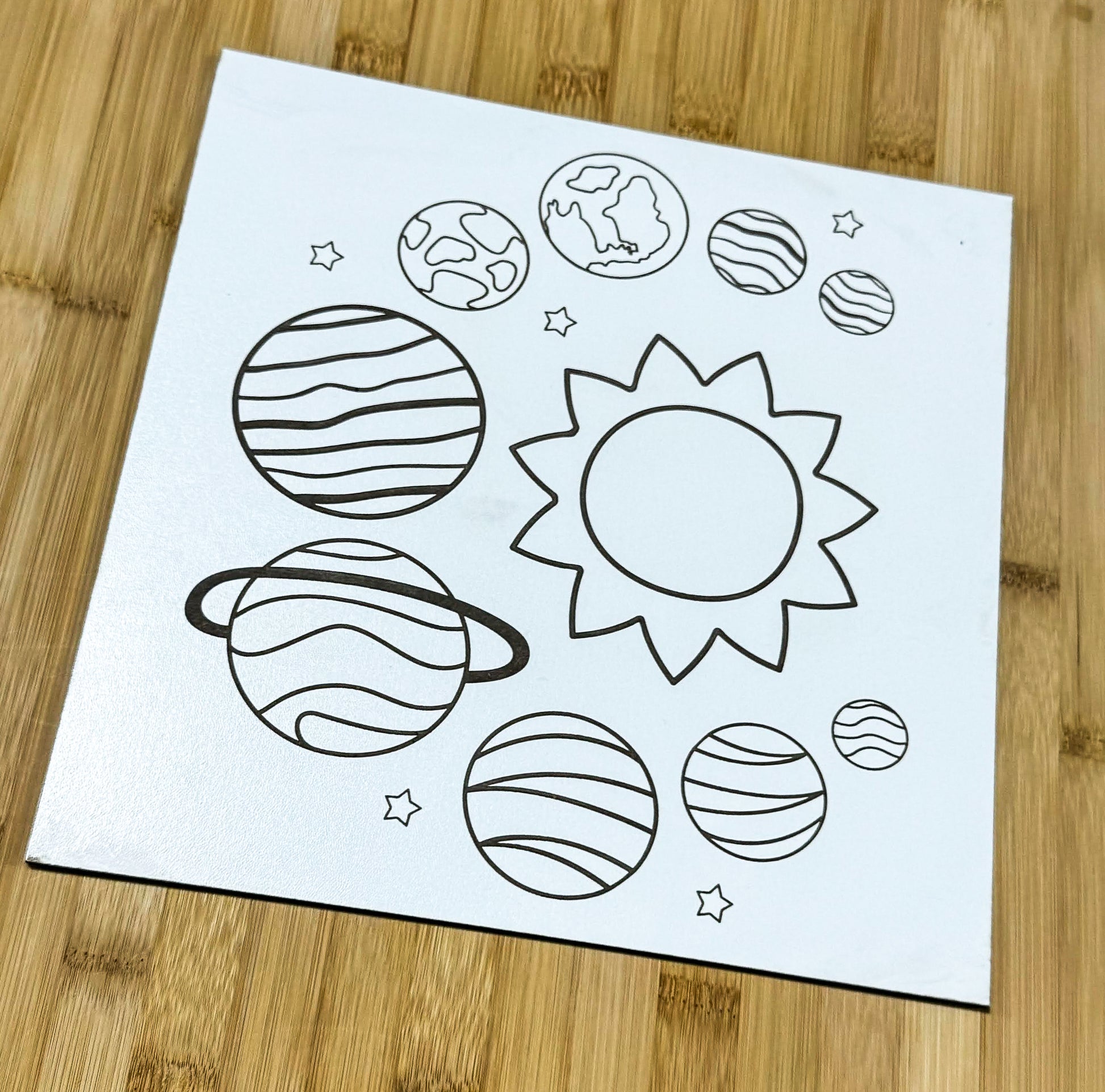 a drawing of planets on a piece of paper