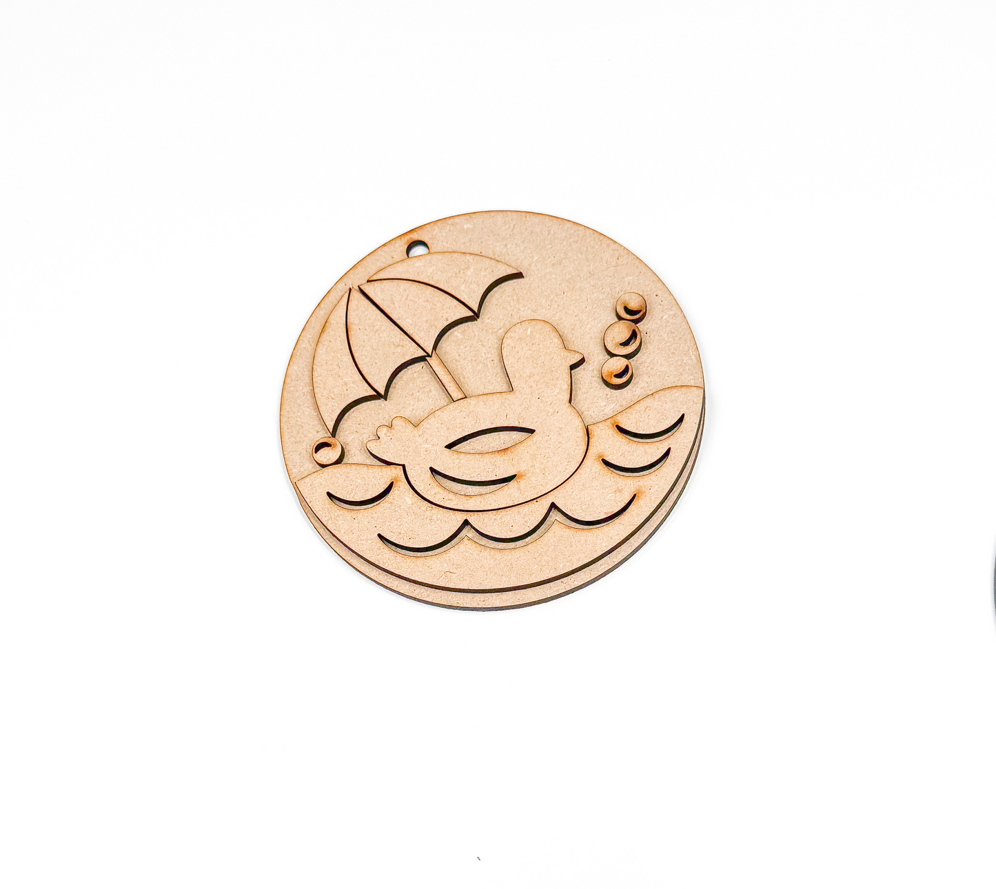 a couple of wooden buttons sitting on top of a white table