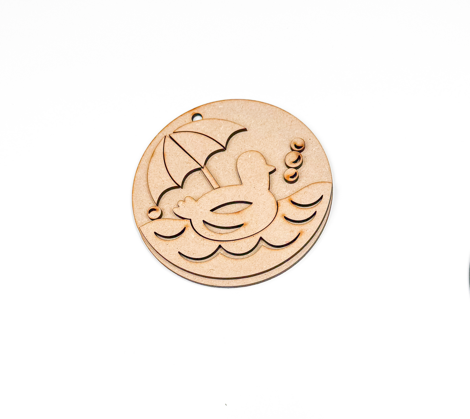 a couple of wooden buttons sitting on top of a white table