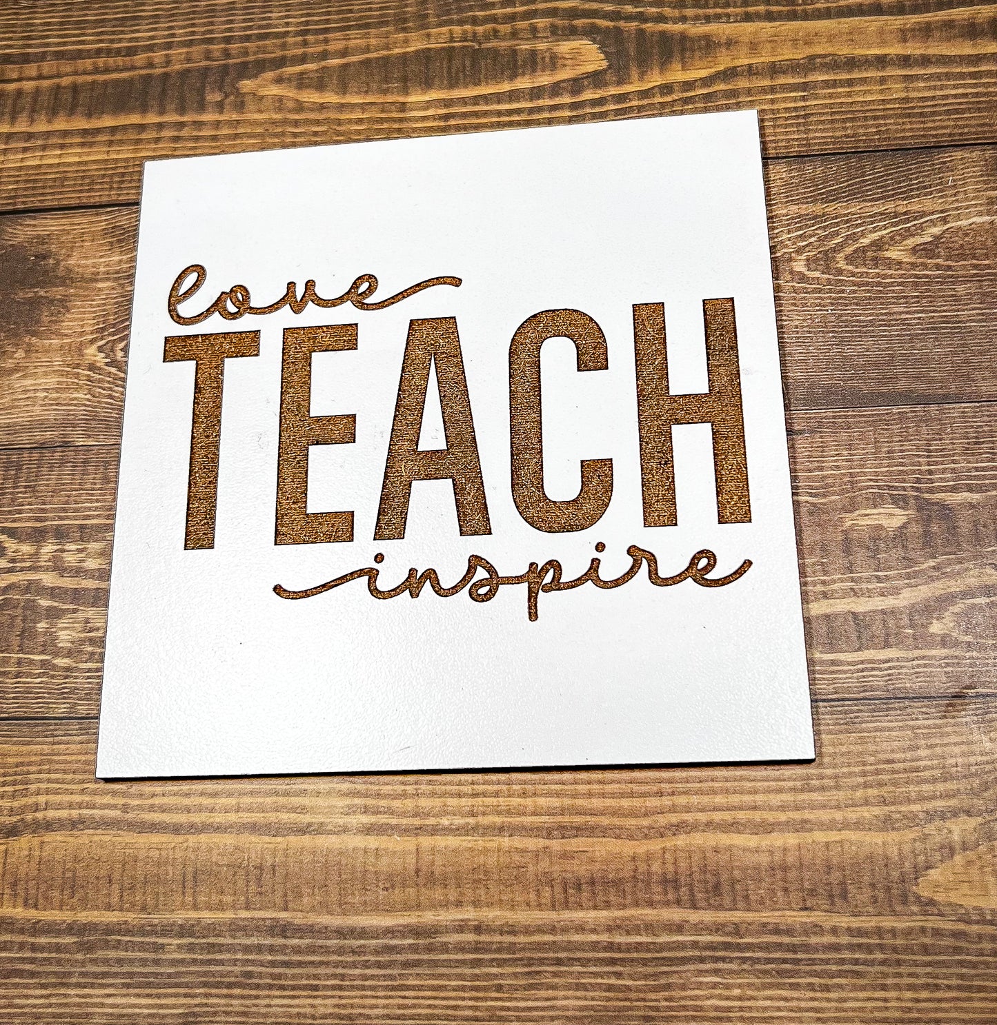 a piece of paper that says leave teach inspire