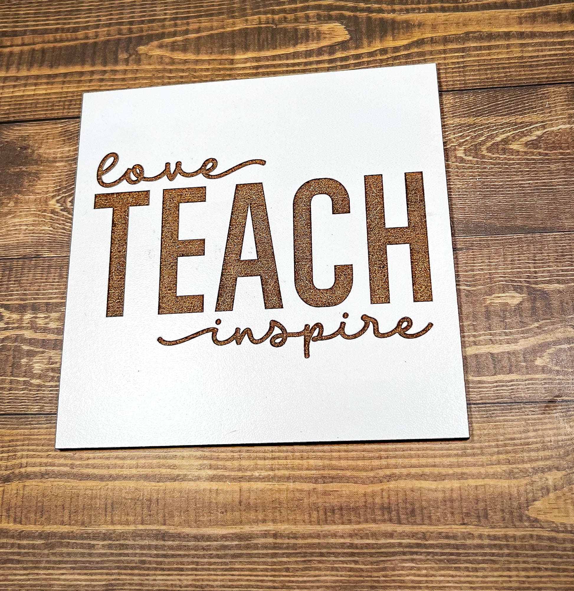 a piece of paper that says leave teach inspire