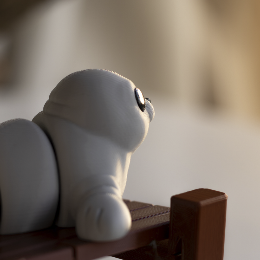 A small white toy figurine is sitting on a wooden surface, looking off to the side.