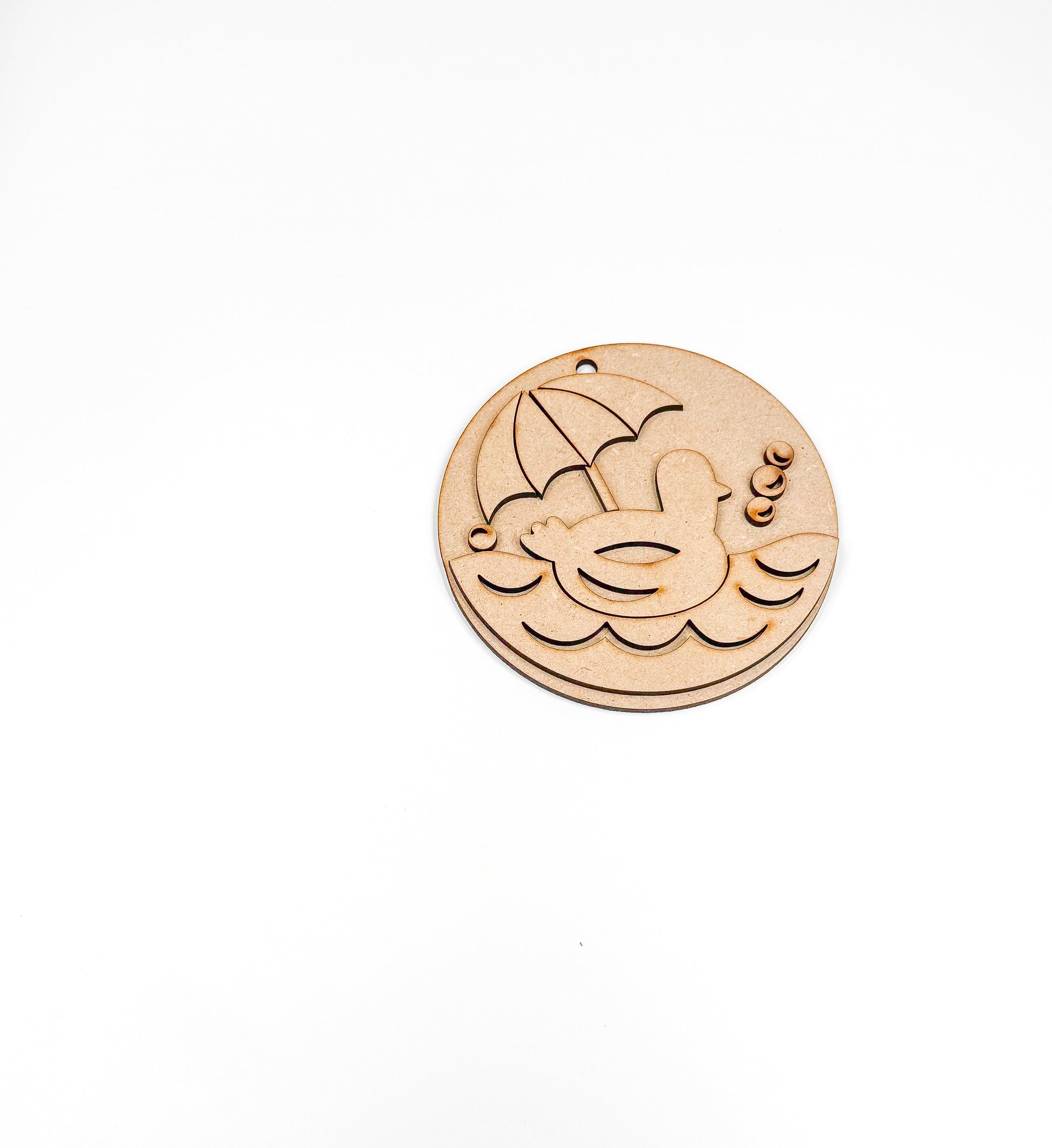 a wooden button with an umbrella on it