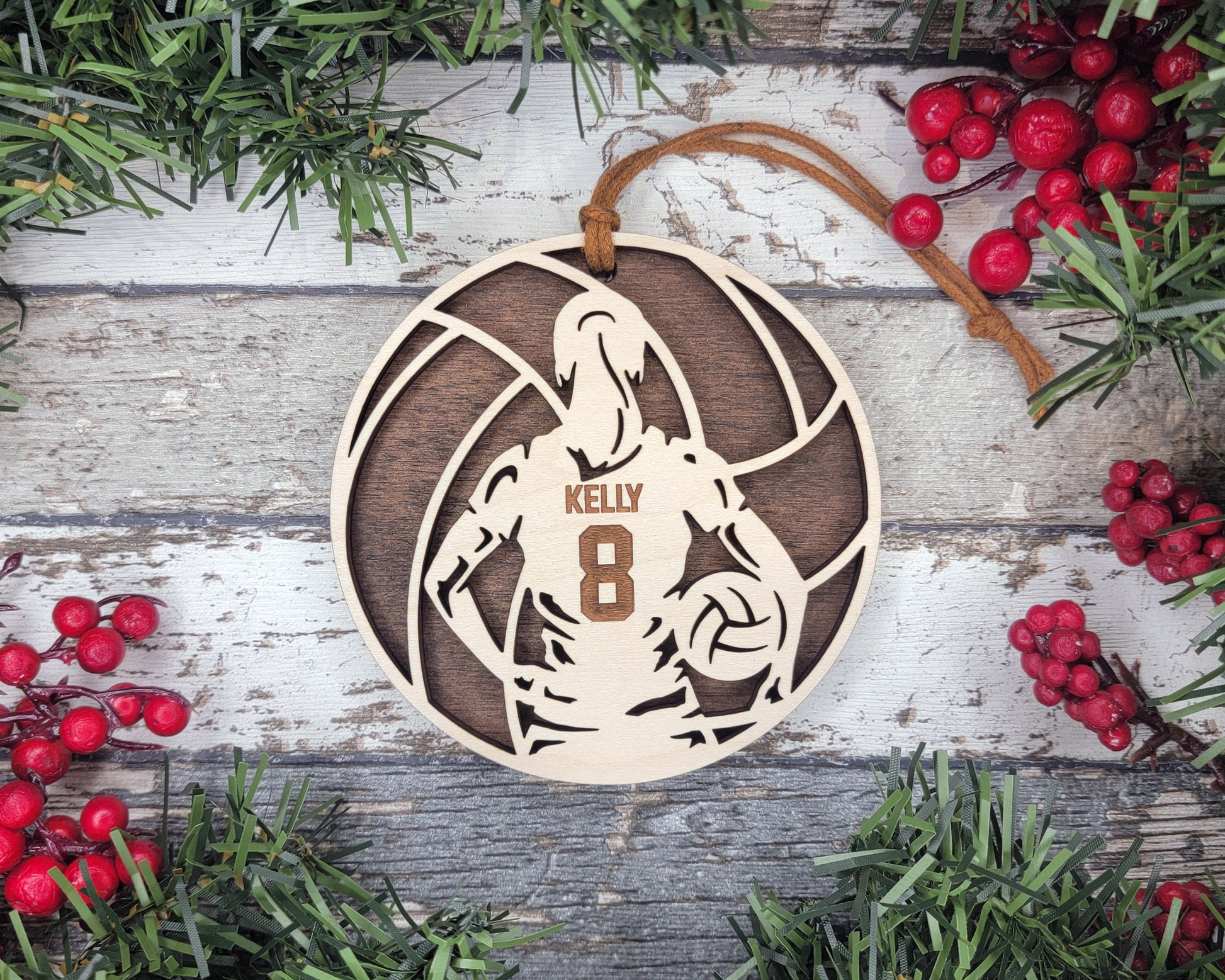 a wooden ornament with a basketball player on it