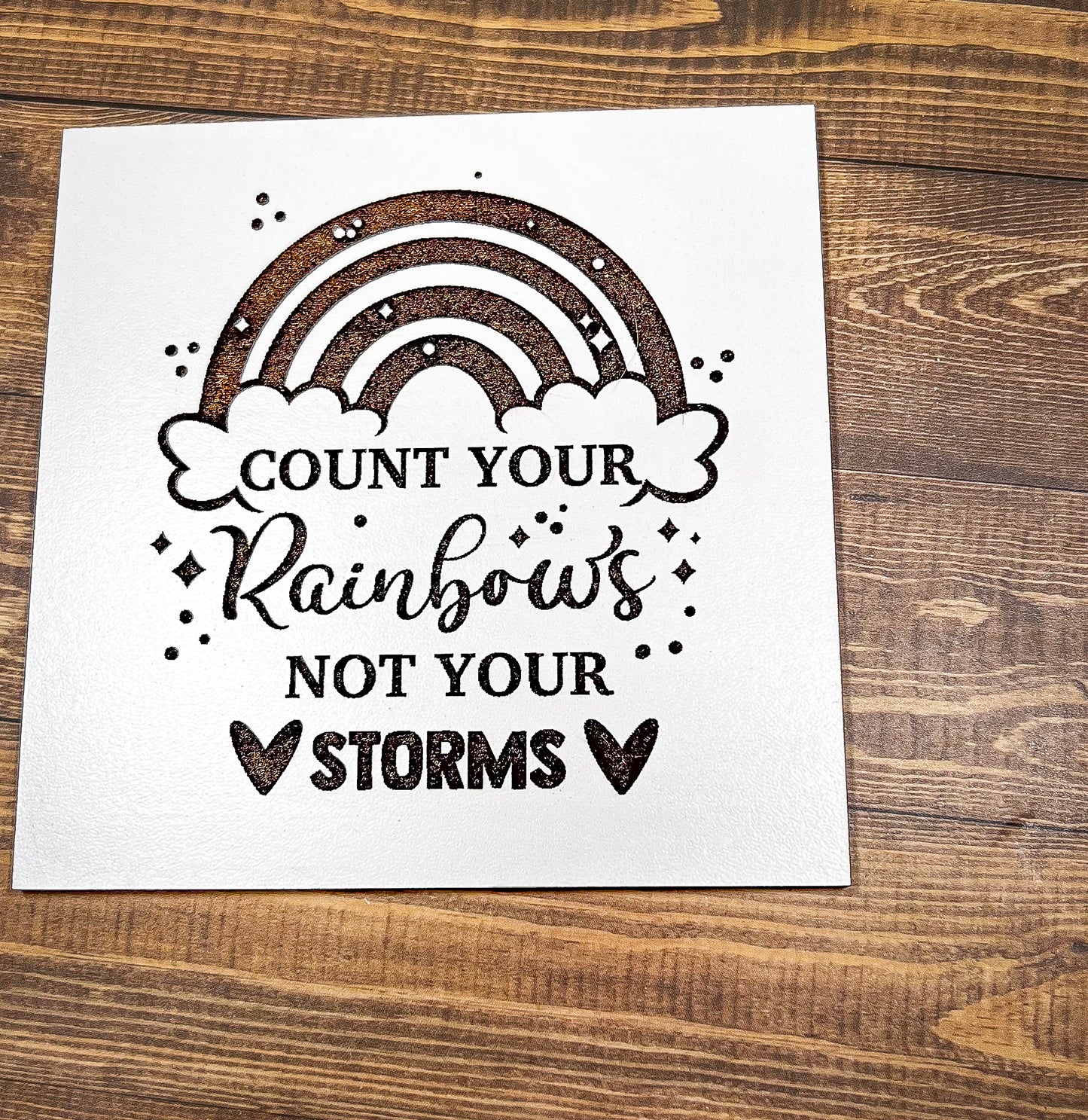 a card that says count your rainbows not your storm
