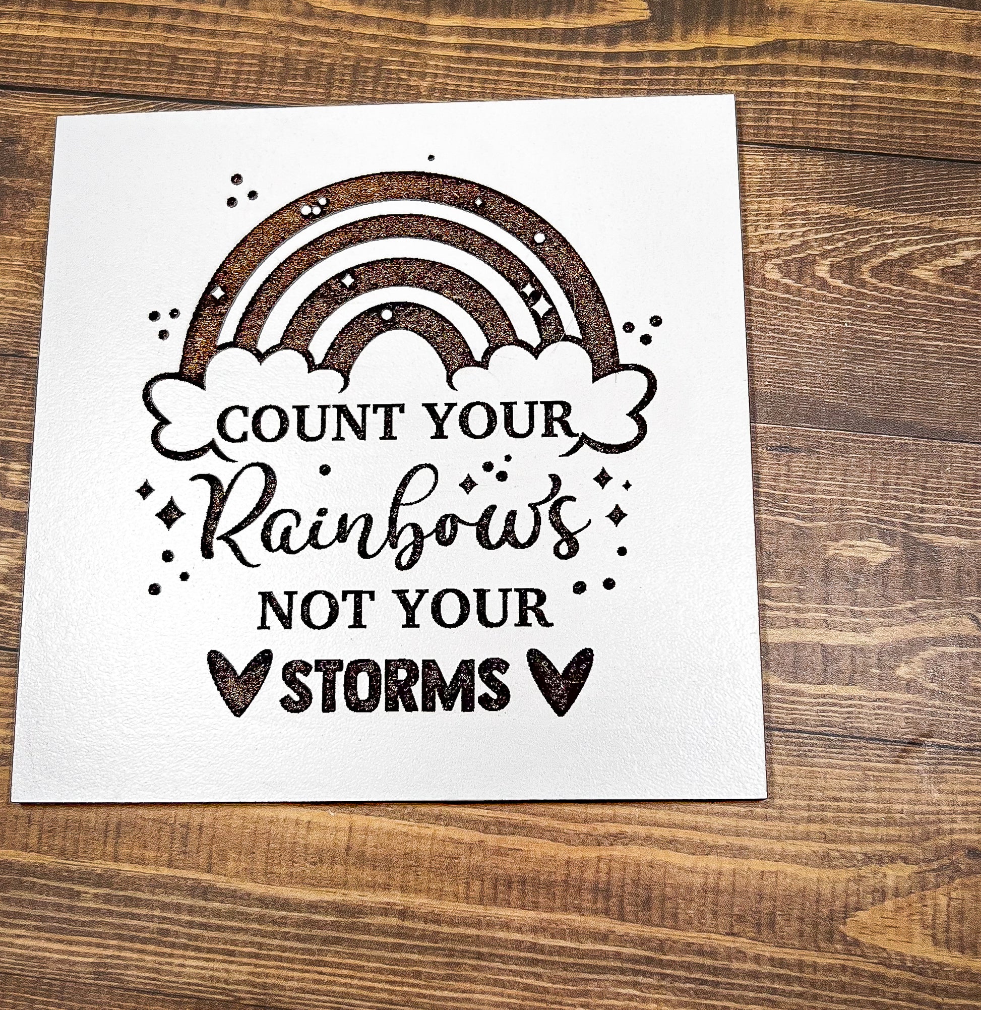 a card that says count your rainbows not your storm