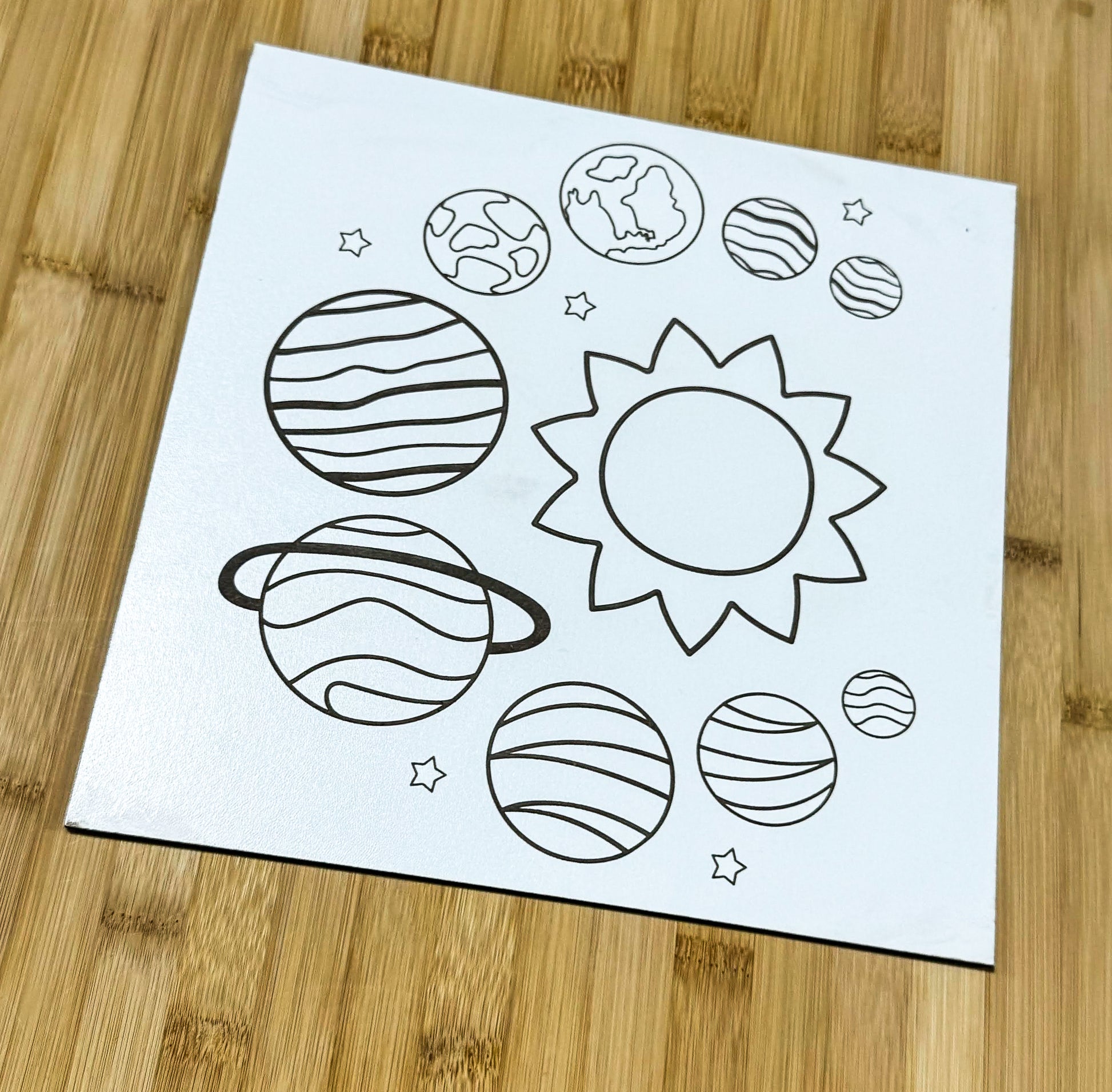 a paper with a picture of planets on it
